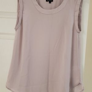 Its a soft lilac sheer sleeveless blouse.